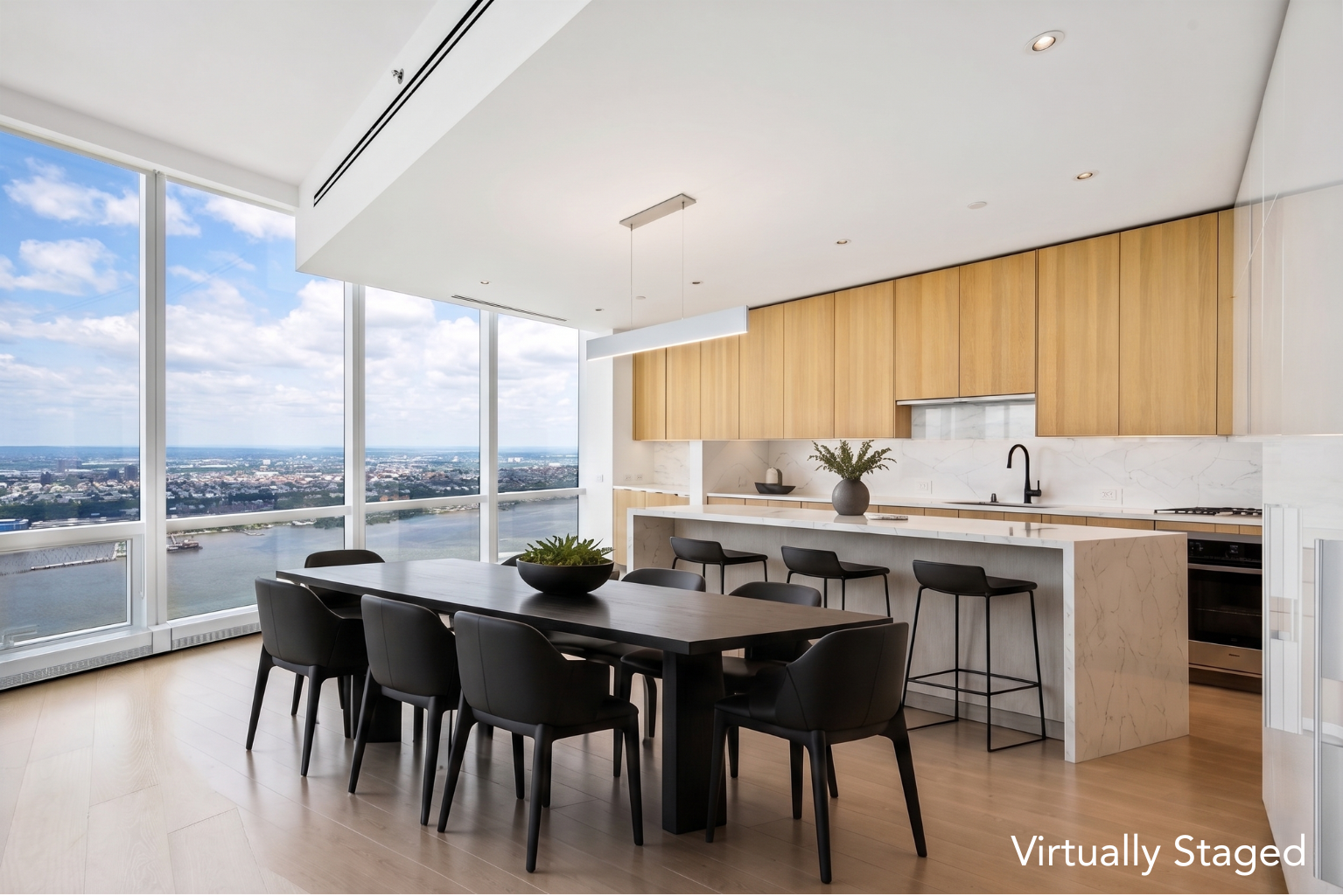15 Hudson Yards, Unit 77B Manhattan, NY 10001 - Photo 4 of 24 a kitchen with a table chairs stove and sink