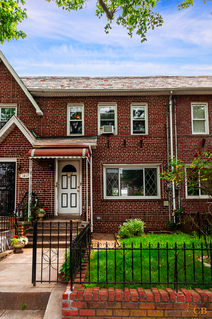 1221 Troy Avenue Brooklyn, NY 11203 - Photo 9 of 10 front view of a house with a garden