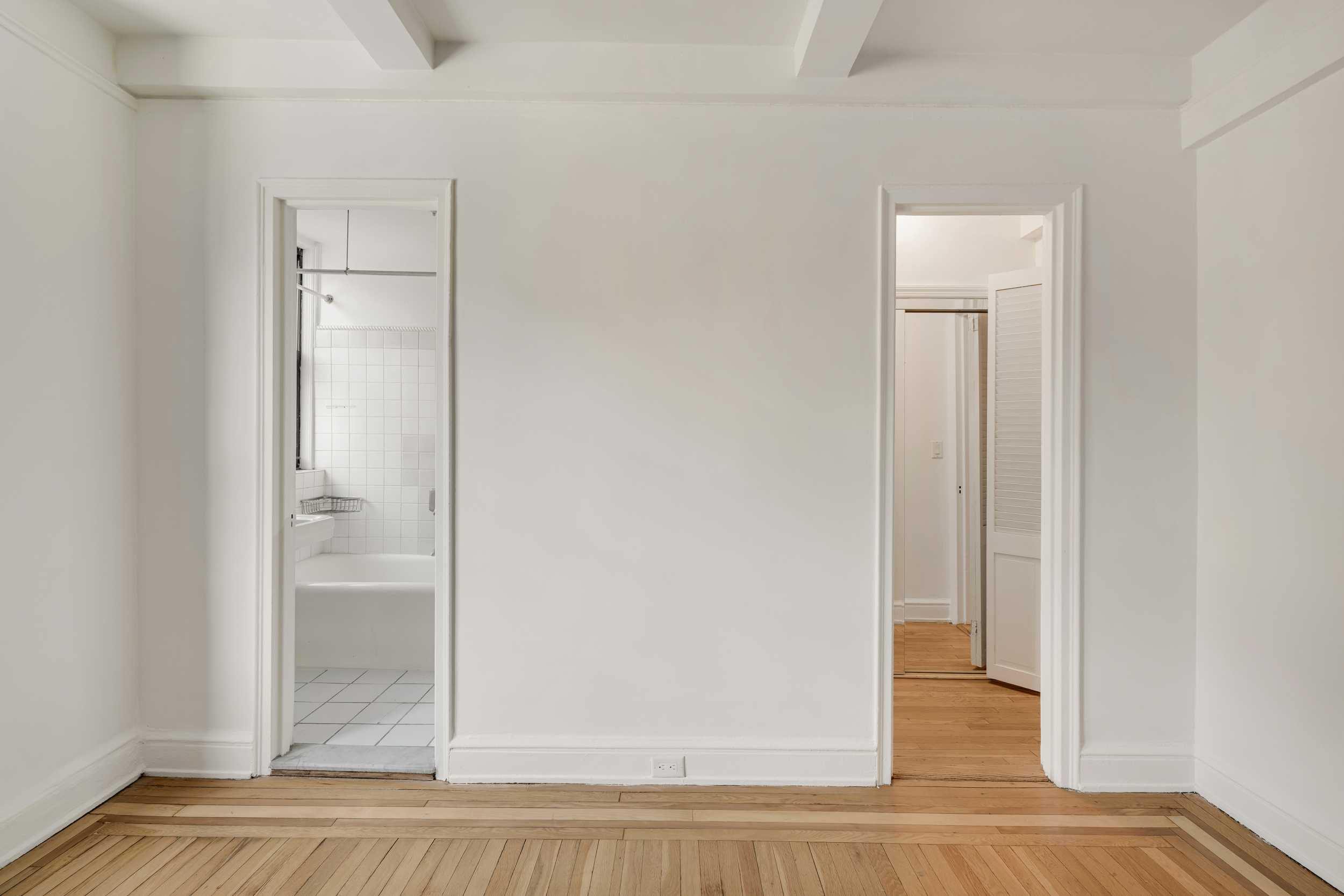 74 West 68th Street, Unit 5A Manhattan, NY 10023 - Photo 21 of 25 a view of a bathroom with a glass door