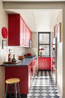 a kitchen with stainless steel appliances granite countertop a stove refrigerator sink and cabinets