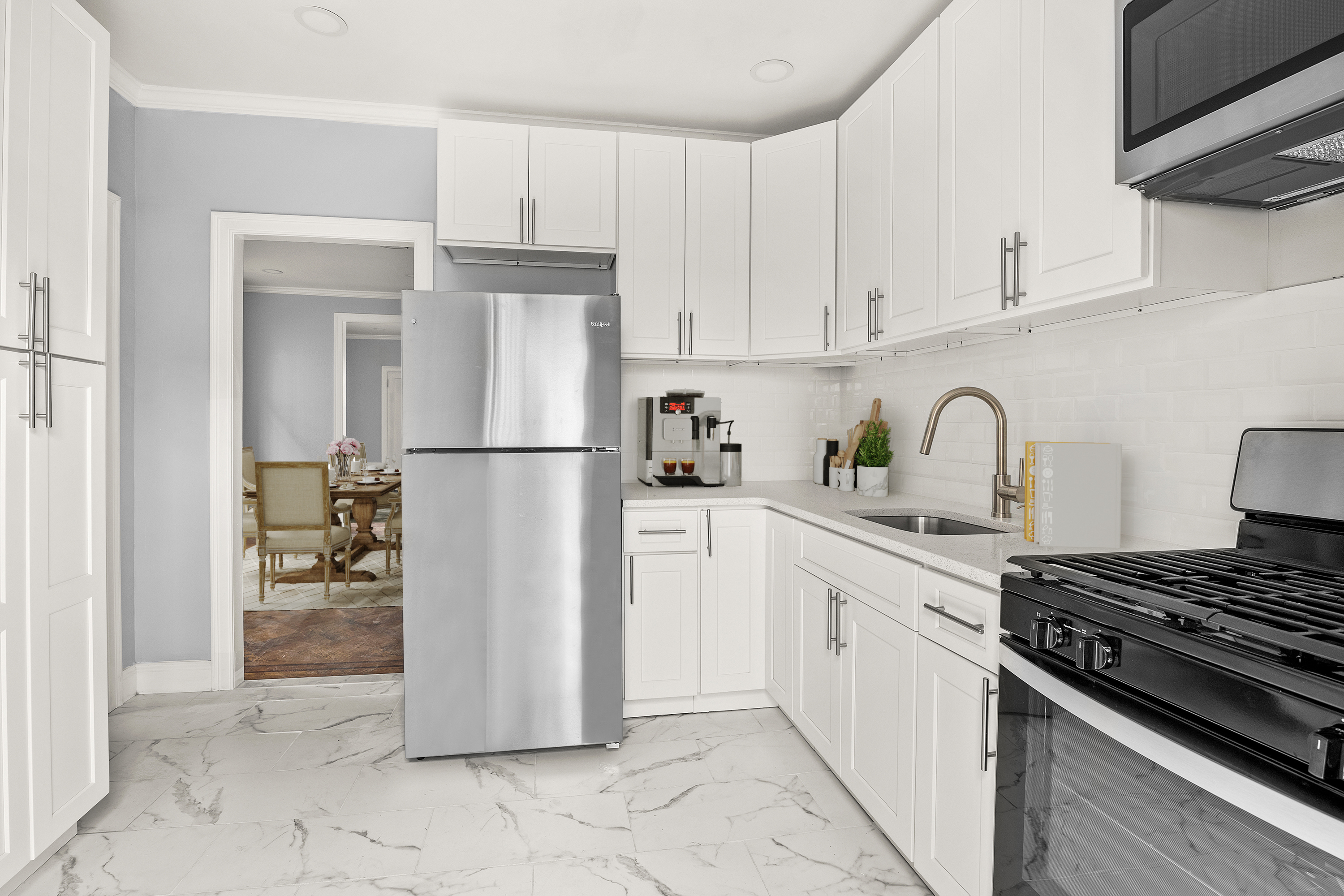 806 East 48th Street Brooklyn, NY 11203 - Photo 4 of 13 a kitchen with a refrigerator and a stove top oven
