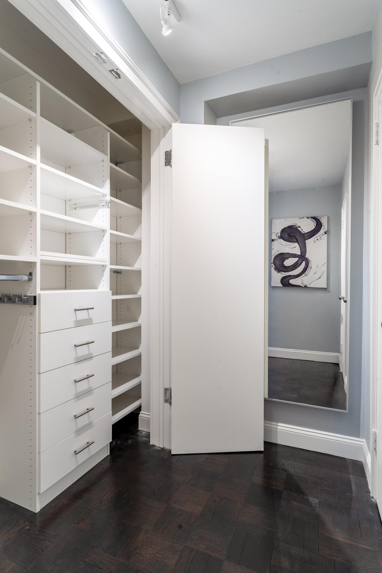 315 East 72nd Street, Unit 16A Manhattan, NY 10021 - Photo 11 of 12 a view of walk in closet with empty racks