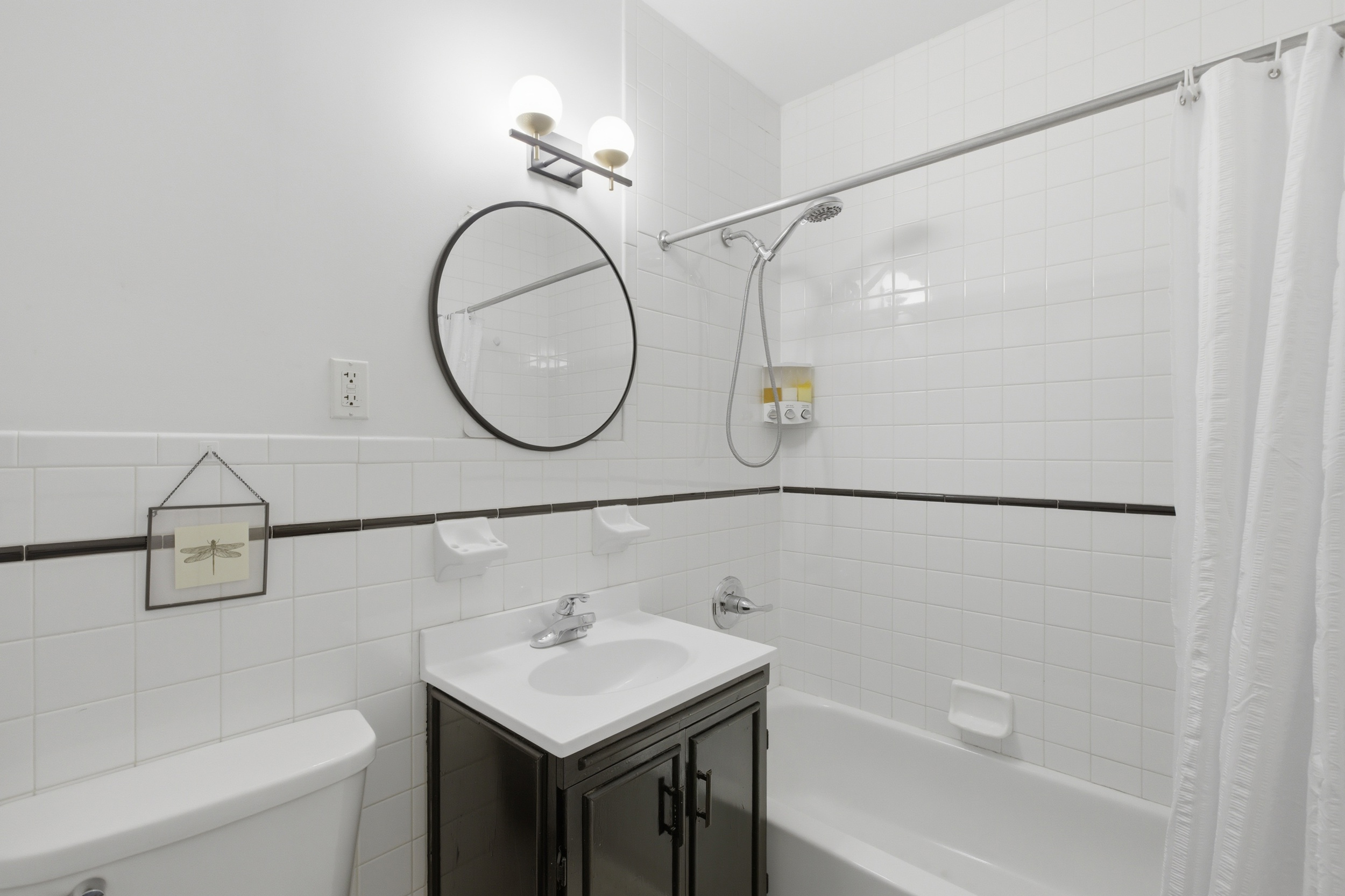 127 West 123rd Street Manhattan, NY 10027 - Photo 18 of 28 a bathroom with a sink and a mirror