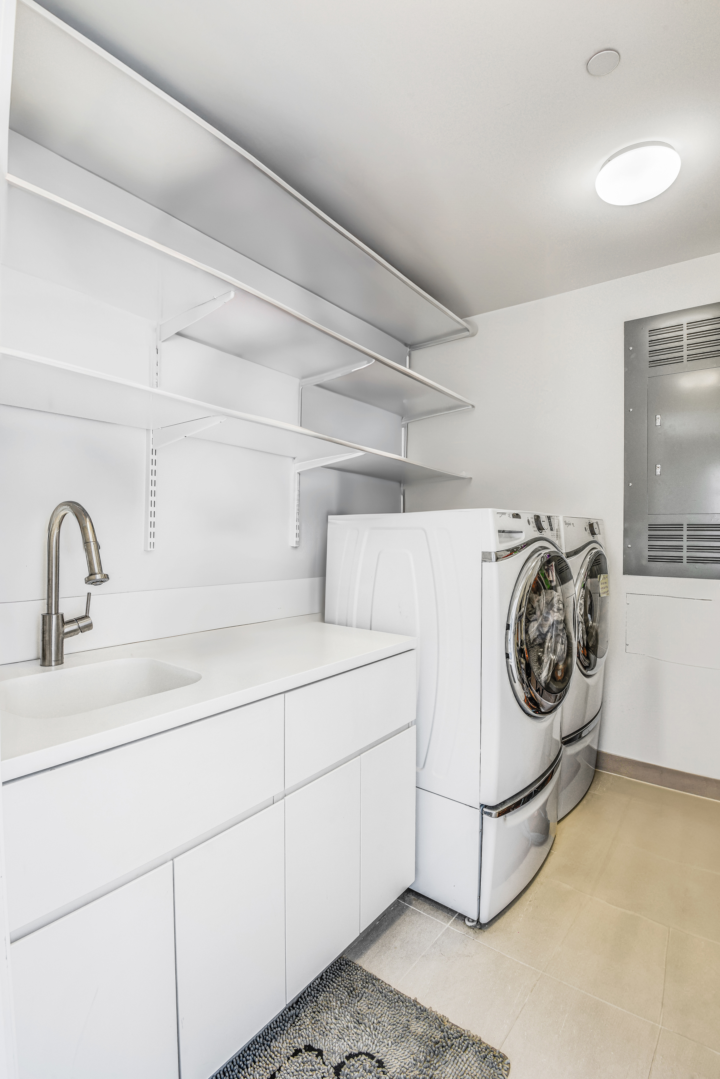 505 West 19th Street, Unit 7W Manhattan, NY 10011 - Photo 24 of 31 a utility room with dryer and washer