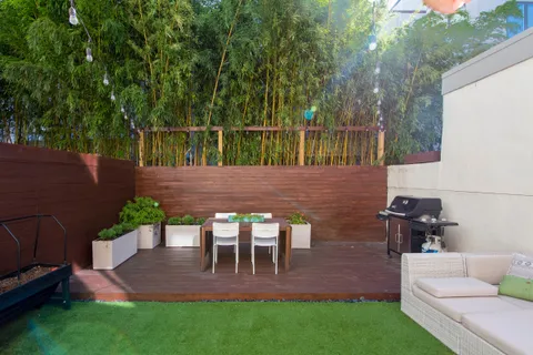 a view of yard with patio