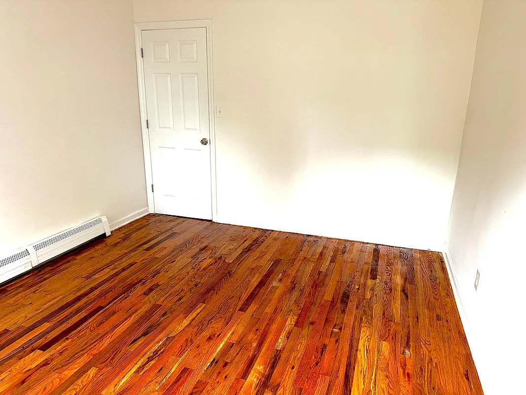 918 Dekalb Avenue, Unit 1 Brooklyn, NY 11221 - Photo 7 of 11 a view of wooden floor in a room