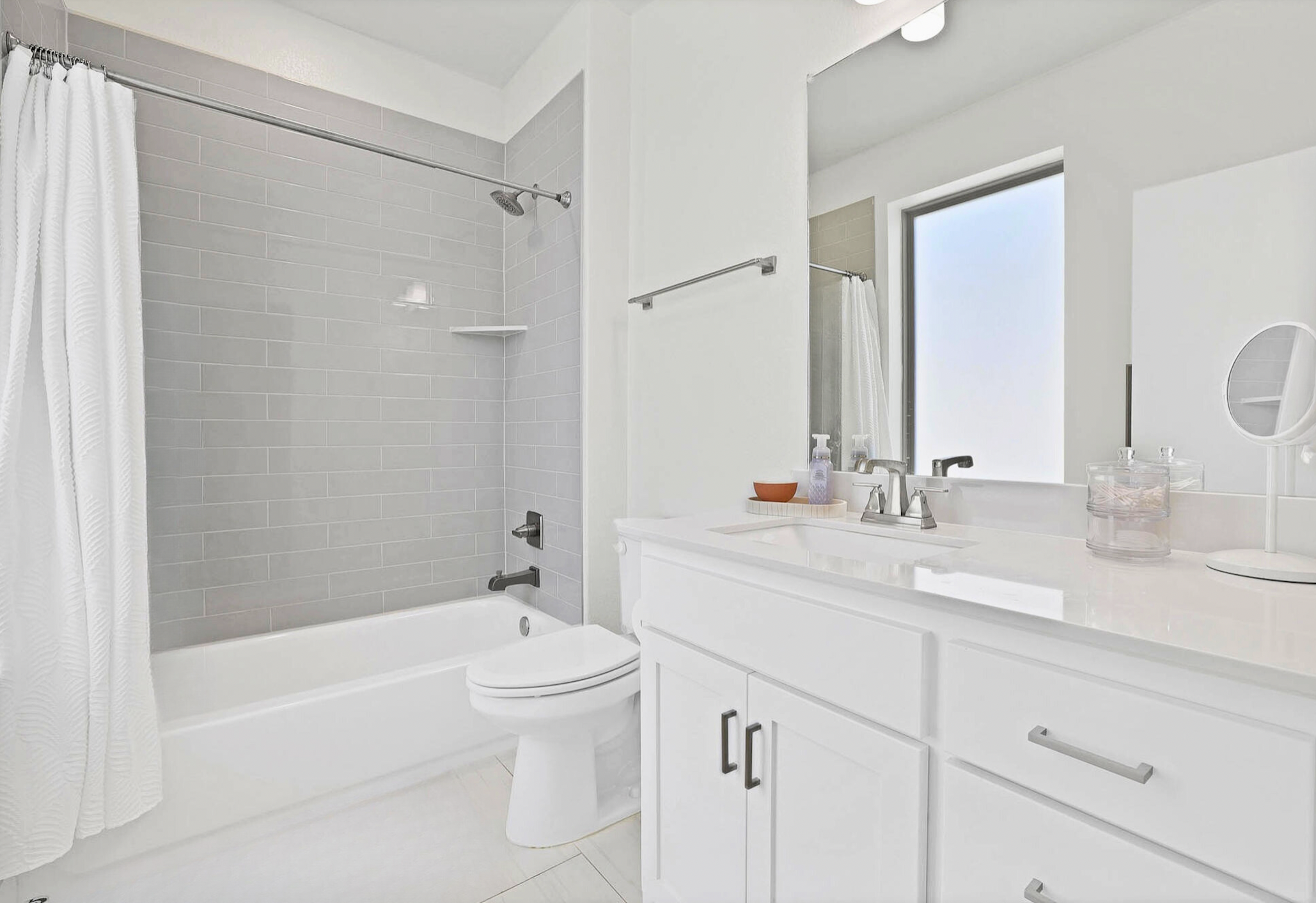 3920 Riesling Ridge Dallas, TX 75204 - Photo 13 of 26 a bathroom with a double vanity sink toilet mirror and bathtub