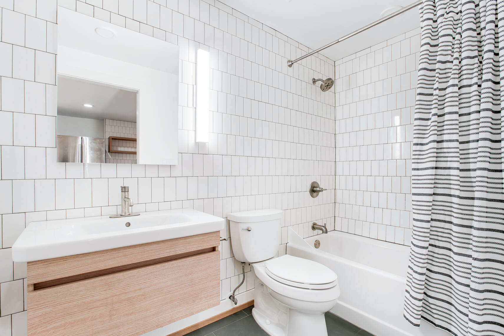 14 Hampton Place Brooklyn, NY 11213 - Photo 7 of 12 a bathroom with a sink a toilet and shower