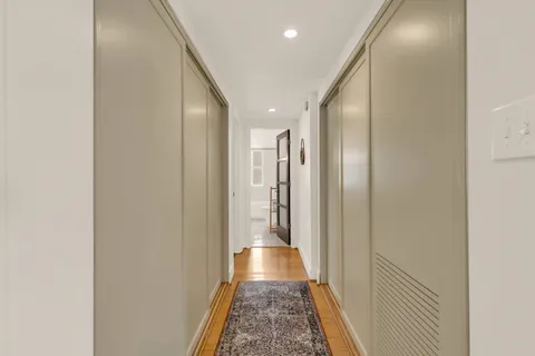 a room with wooden floor and a sink