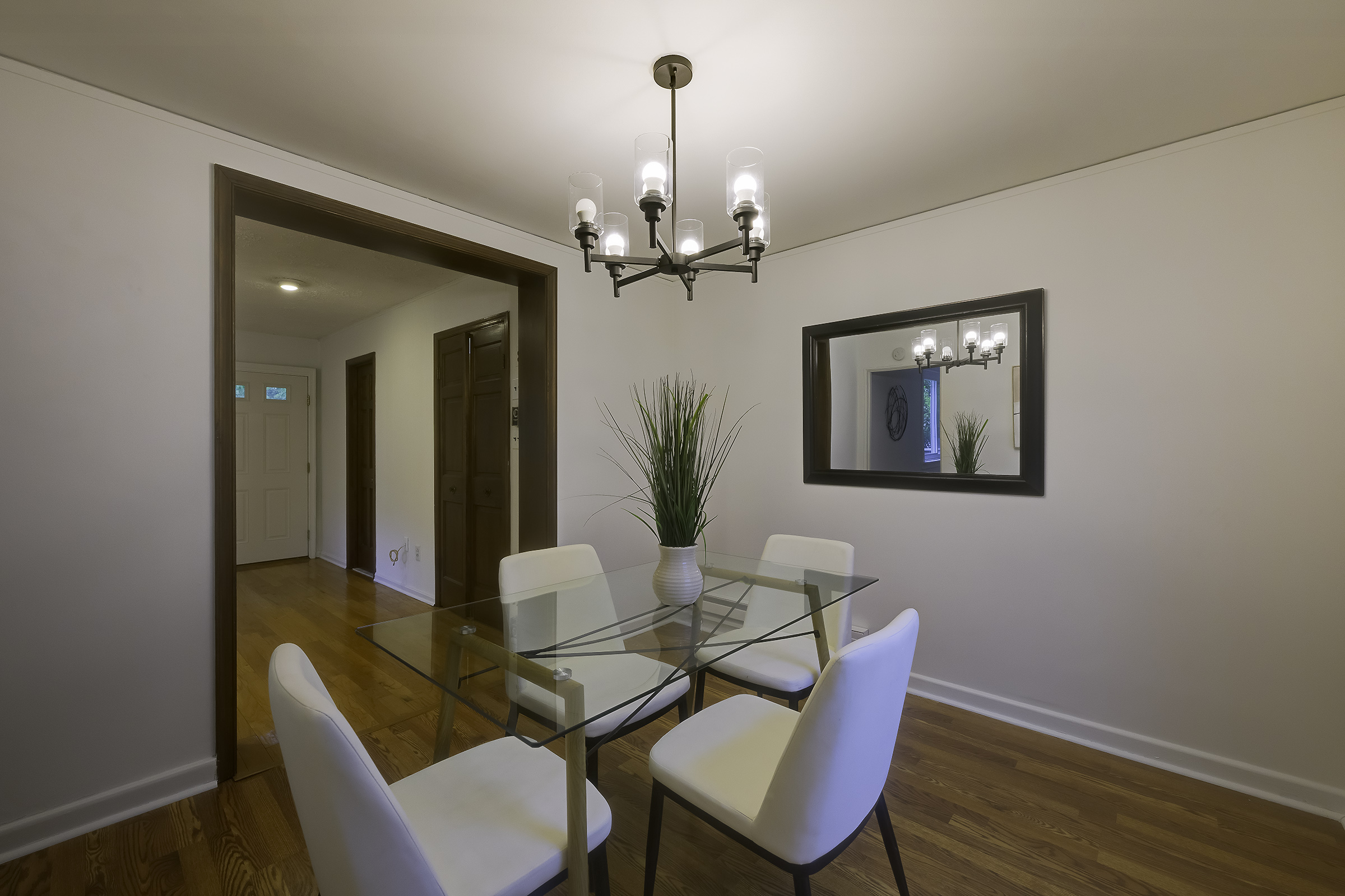 45 D Ridge Road Greenbelt, MD 20770 - Photo 19 of 35 a view of a dining room with furniture wooden floor and a chandelier