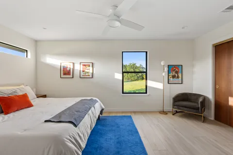 a bedroom with bed and a couch
