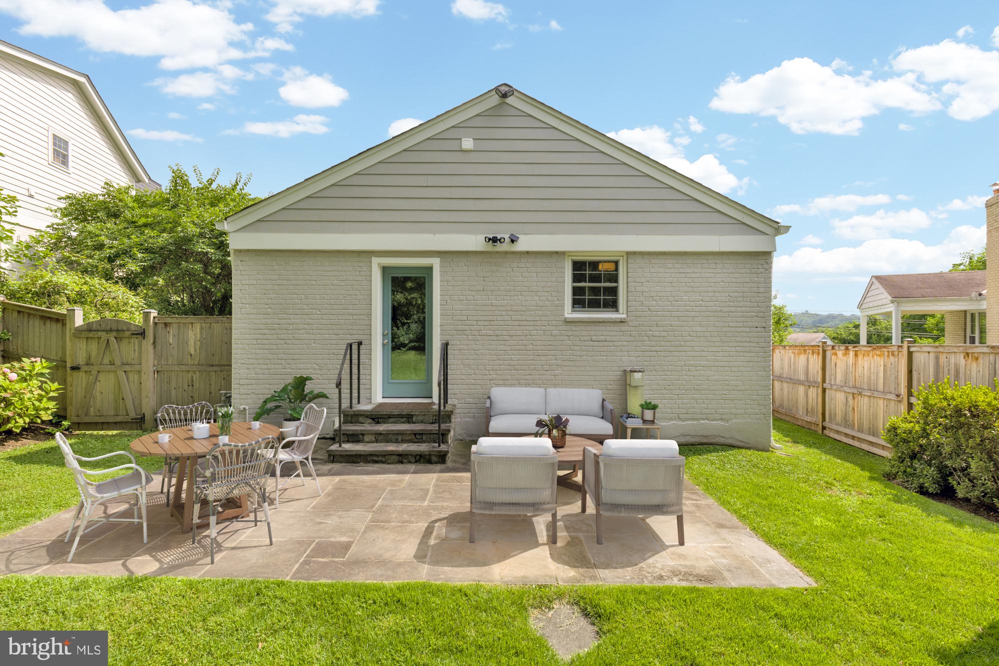 2611 Ross Road Chevy Chase, MD 20815 - Photo 34 of 37 a view of a patio with table and chairs and potted plants