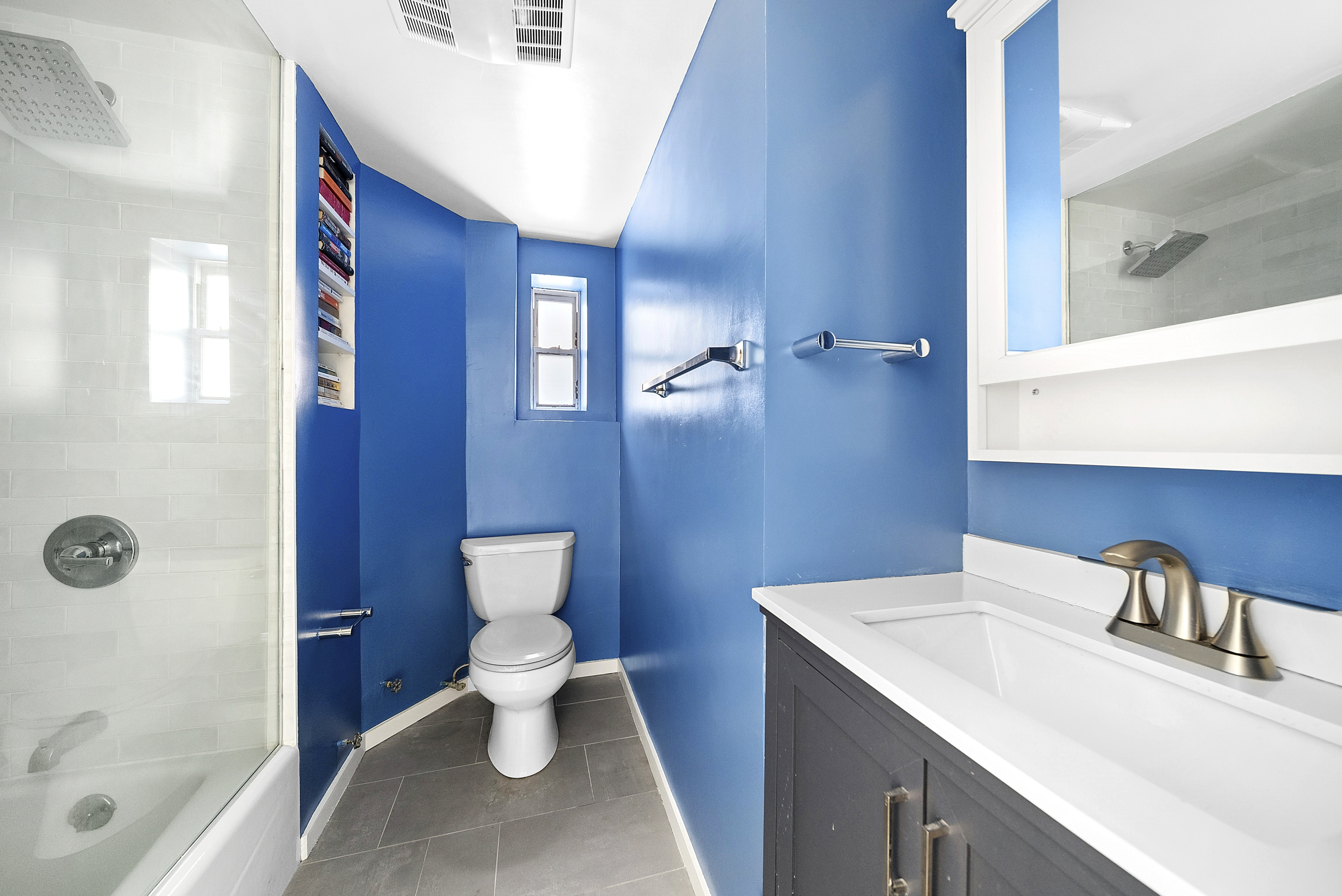 153 West 80th Street, Unit 4B Manhattan, NY 10024 - Photo 4 of 5 a bathroom with a sink a toilet and shower