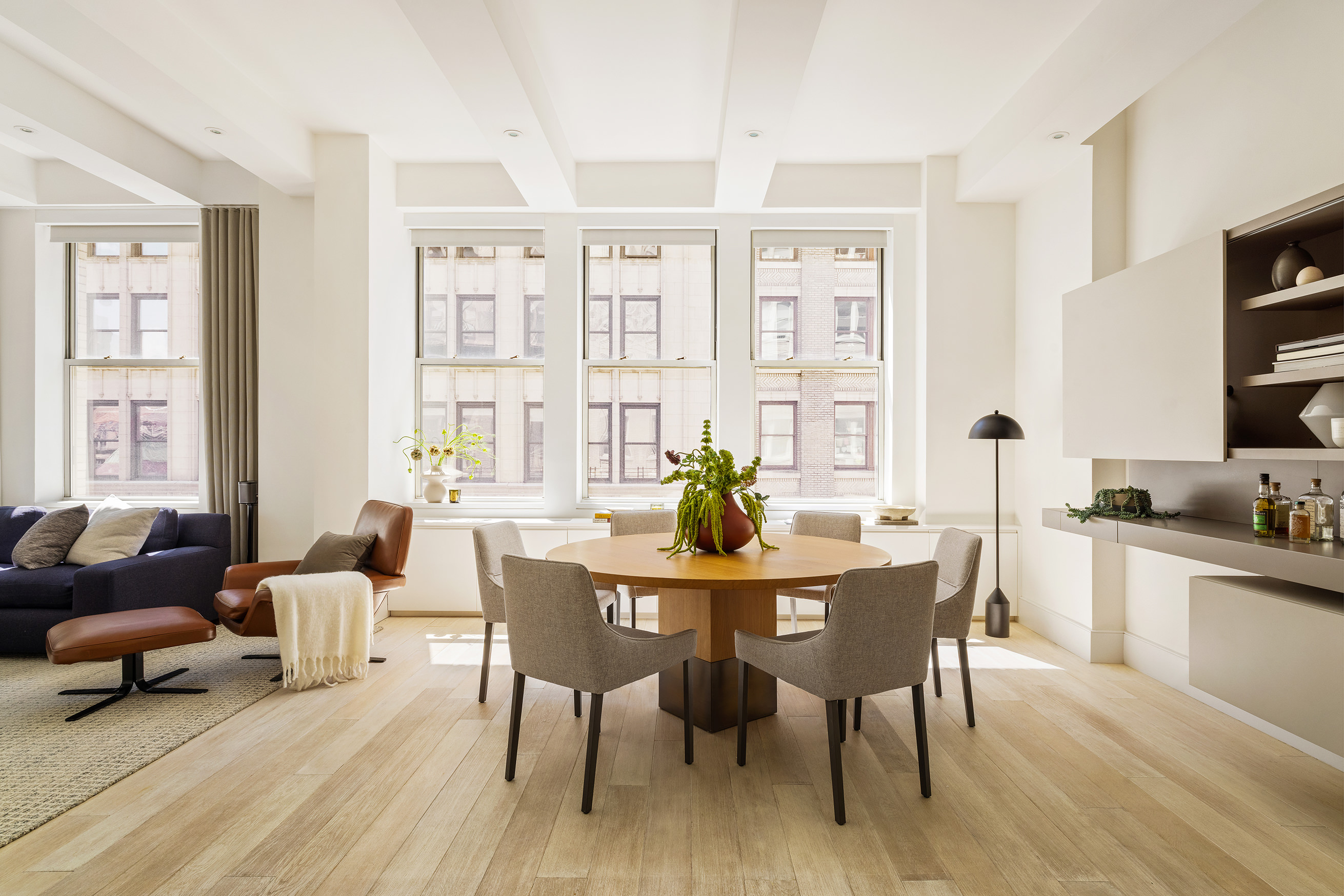 a view of a dining room with furniture window and wooden floor