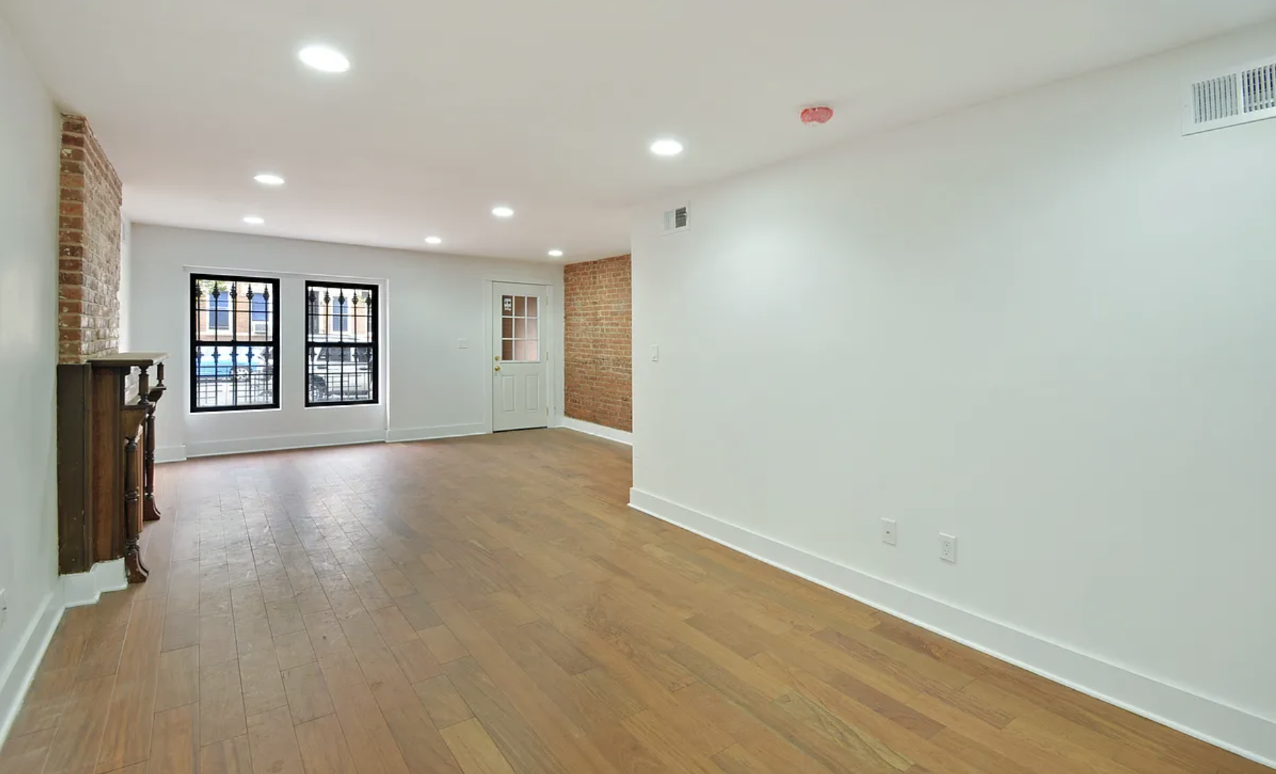 698 Halsey Street Brooklyn, NY 11233 - Photo 10 of 13 an empty room with windows and ceiling fan