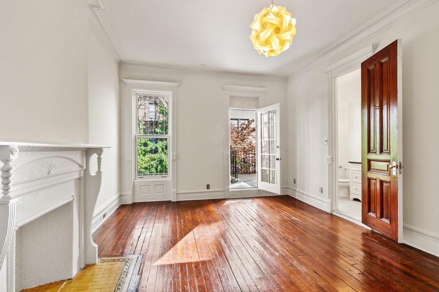 143 West 78th Street Manhattan, NY 10024 - Photo 12 of 17 an entryway with wooden floor and cabinet