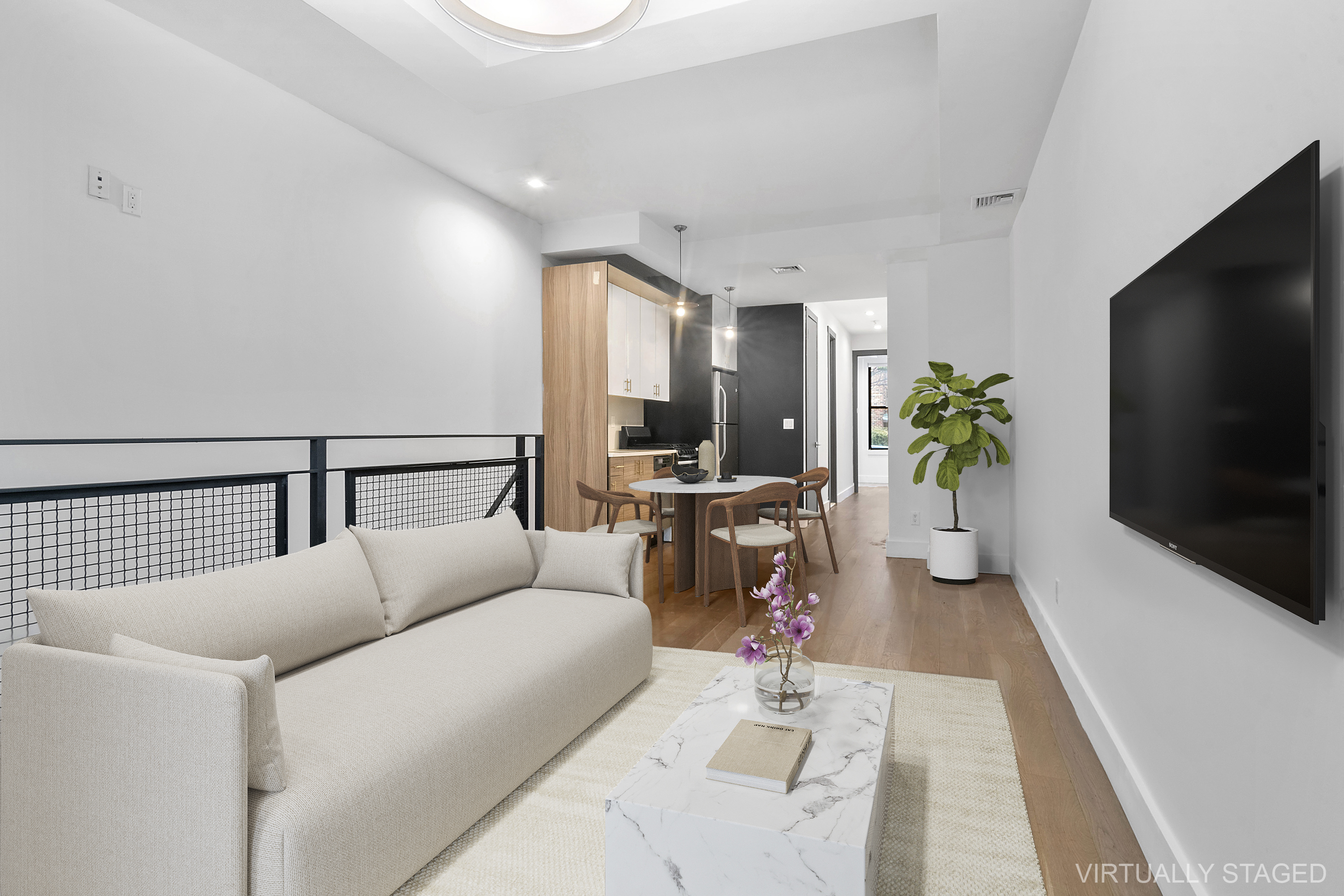 20-27 Menahan Street, Unit 1R Queens, NY 11385 - Photo 5 of 12 a living room with furniture and a flat screen tv