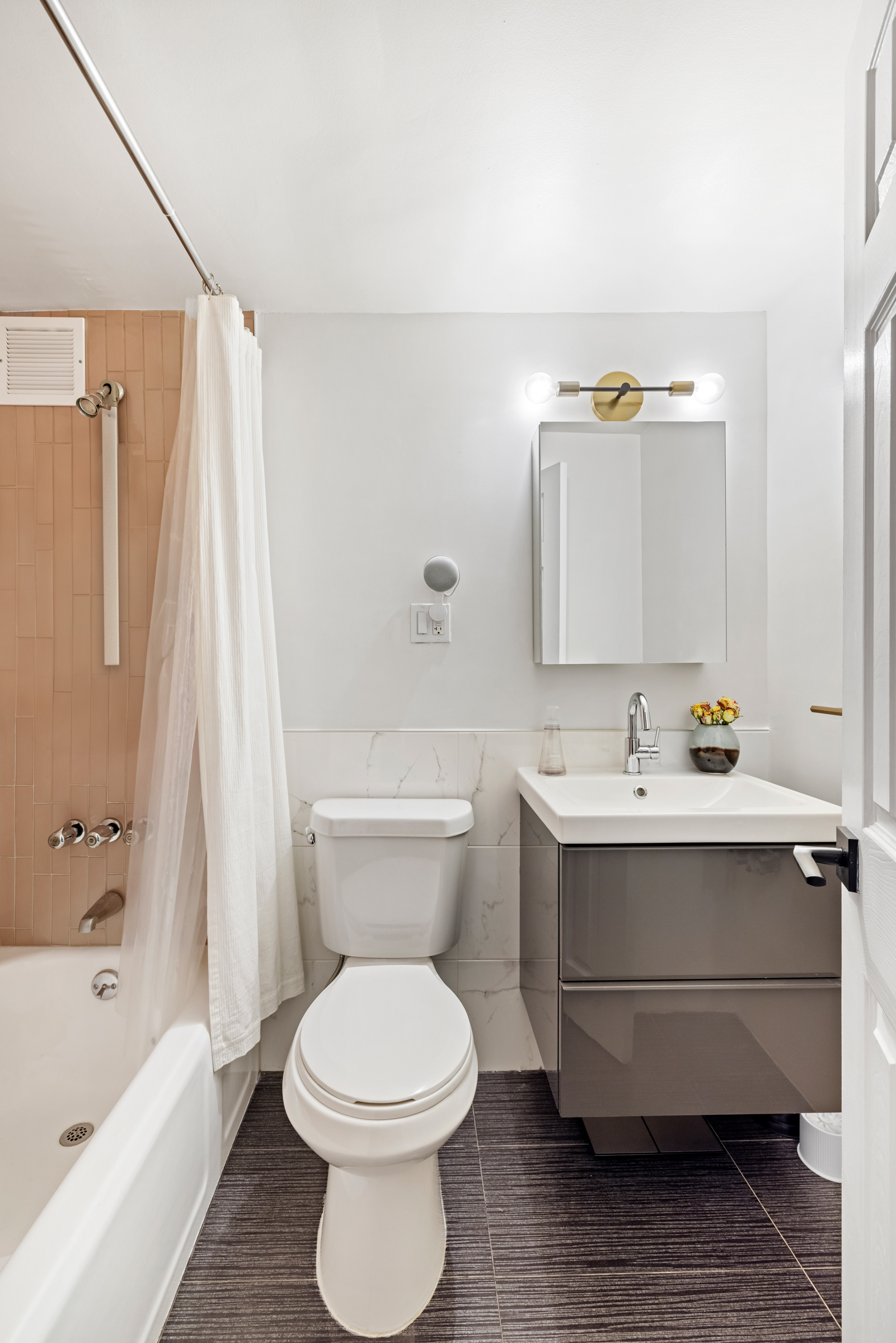 325 Clinton Avenue, Unit 7A Brooklyn, NY 11205 - Photo 9 of 13 a bathroom with a sink toilet and shower