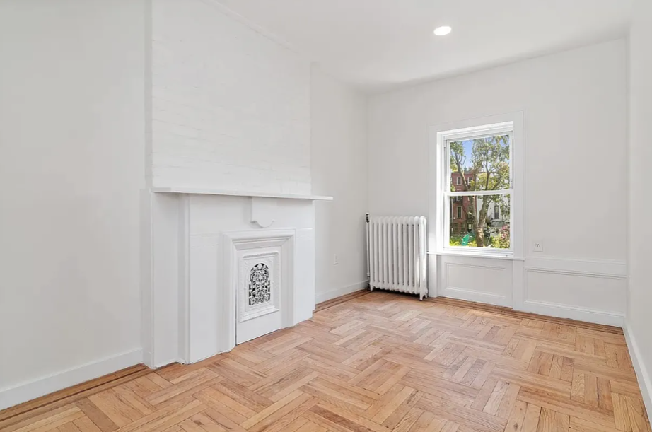278 Macon Street, Unit 1 Brooklyn, NY 11216 - Photo 4 of 7 a view of empty room with closet and window