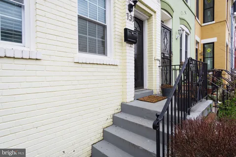 a view of a house with stairs and wooden floor