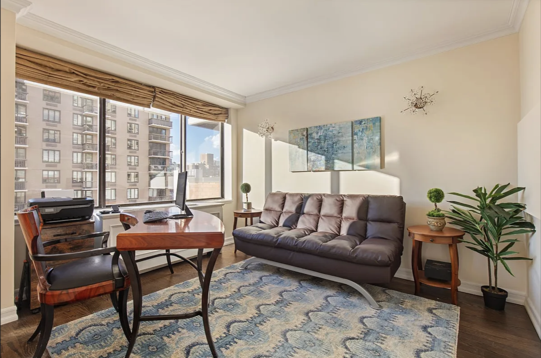 1441 3rd Avenue, Unit 14A Manhattan, NY 10028 - Photo 7 of 10 a living room with furniture and a large window