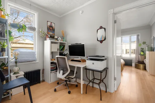 a view of a workspace with furniture