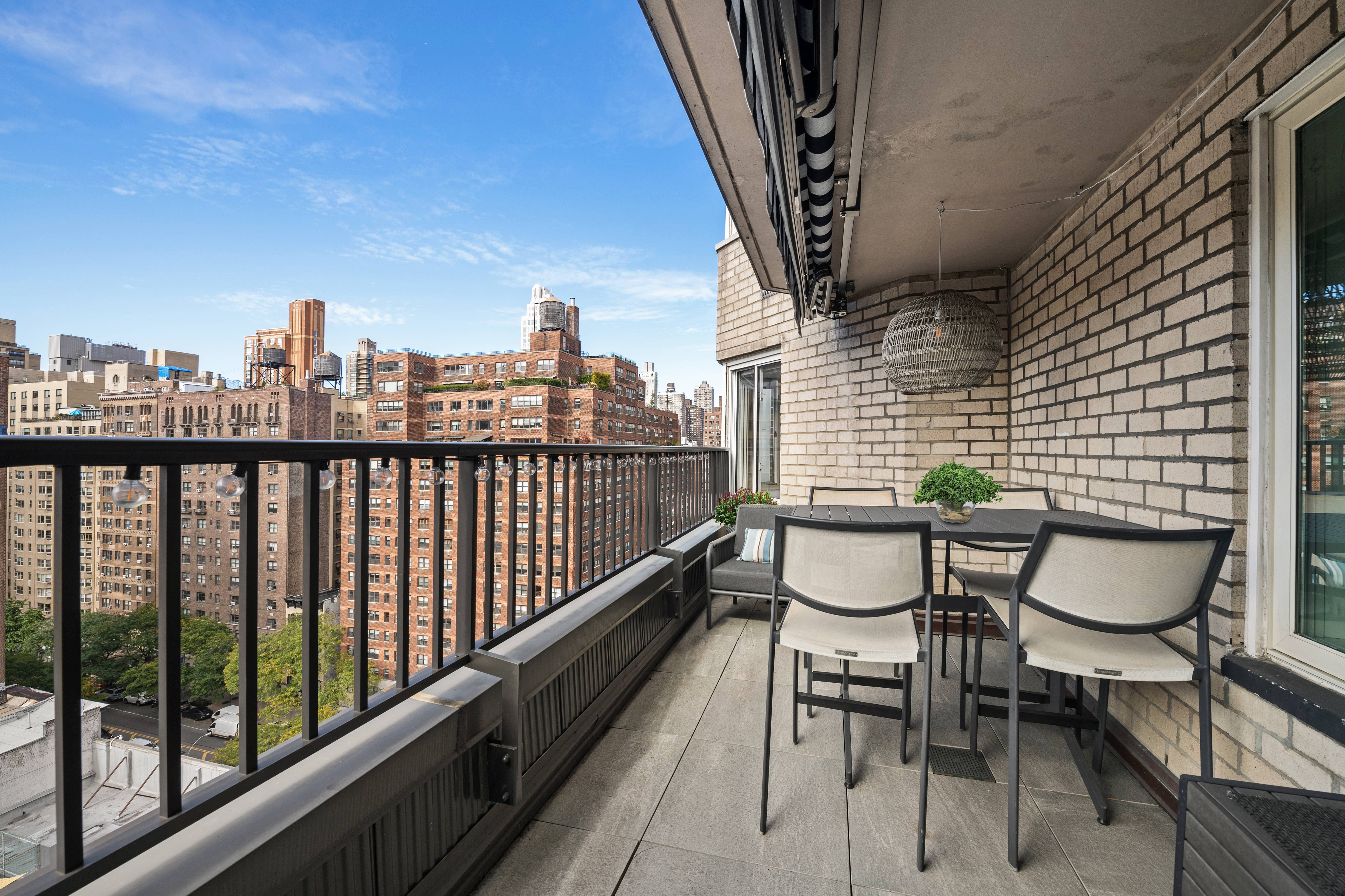 301 East 78th Street, Unit 16EF Manhattan, NY 10075 - Photo 5 of 12 a balcony with table and chairs