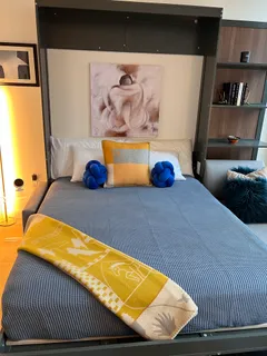 a bedroom with a bed and dresser