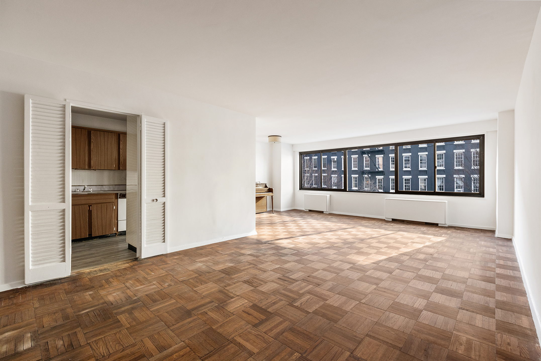 530 East 72nd Street, Unit 3C Manhattan, NY 10021 - Photo 2 of 10 a view of an empty room with a window