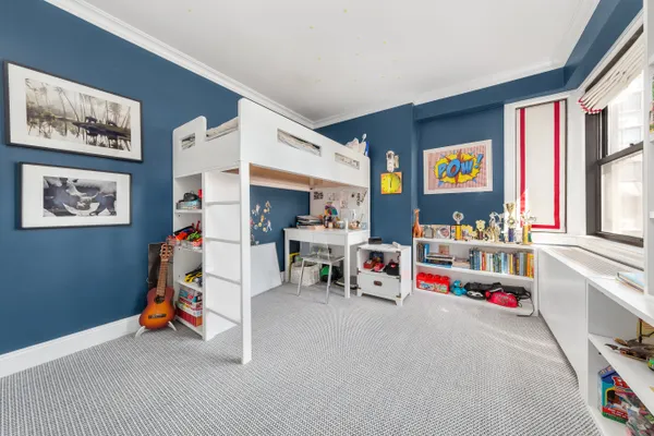 a living room with lots of furniture and a flat screen tv
