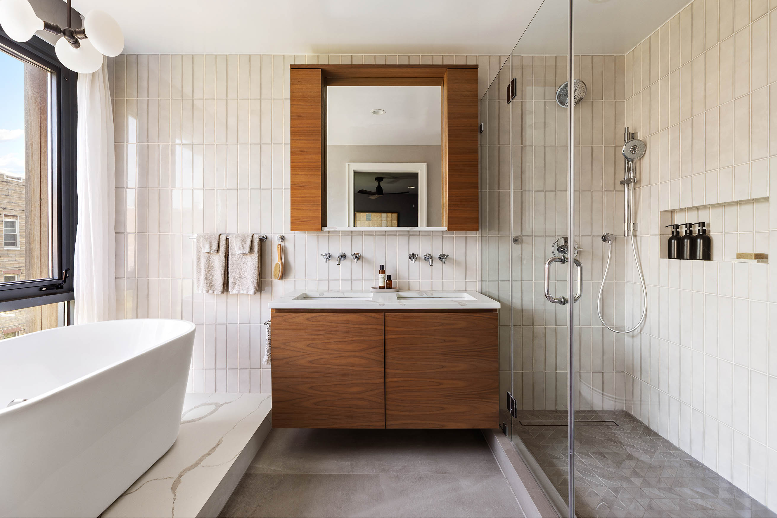 220 North 6th Street, Unit PH Brooklyn, NY 11211 - Photo 7 of 15 a bathroom with a tub sink and mirror