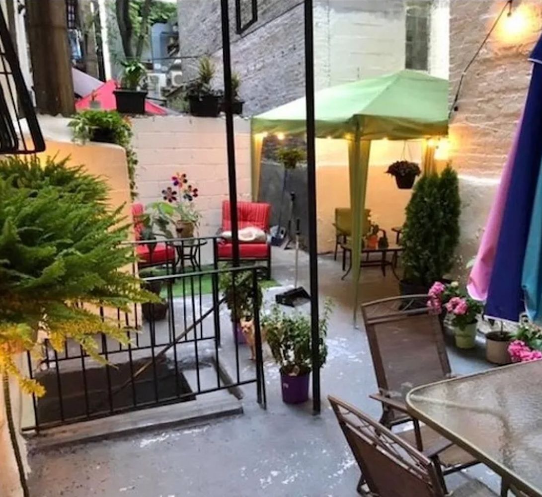 a view of a chairs and table in the patio