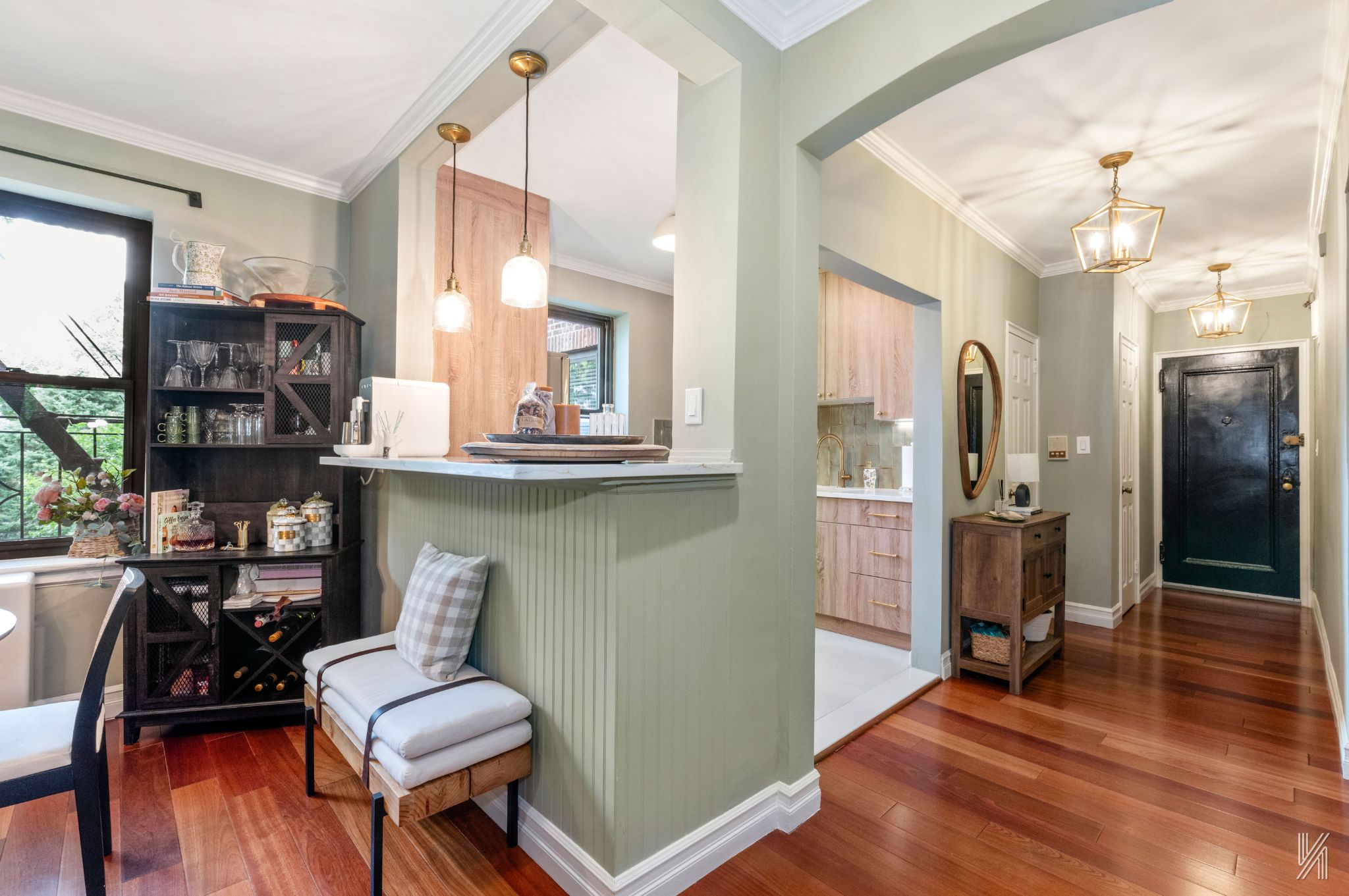 22-31 77th Street, Unit C2 Queens, NY 11370 - Photo 6 of 17 a view of a livingroom with furniture and wooden floor