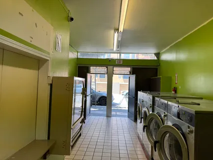 a view of a hallway with washer and dryer