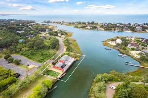 an aerial view of a house with a lake view