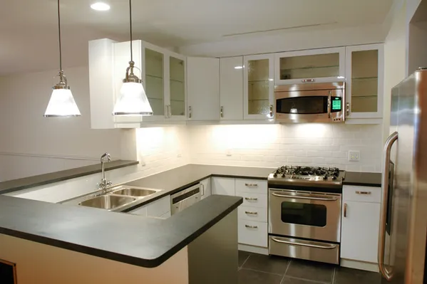 a kitchen that has a sink and a stove