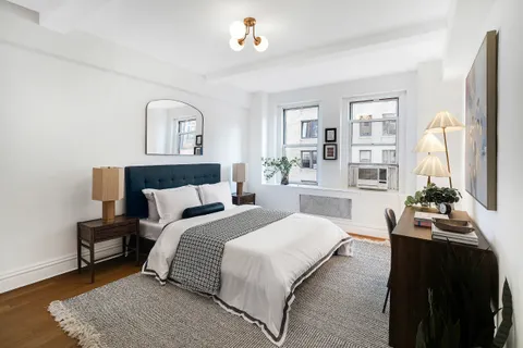 a bedroom with bed and window