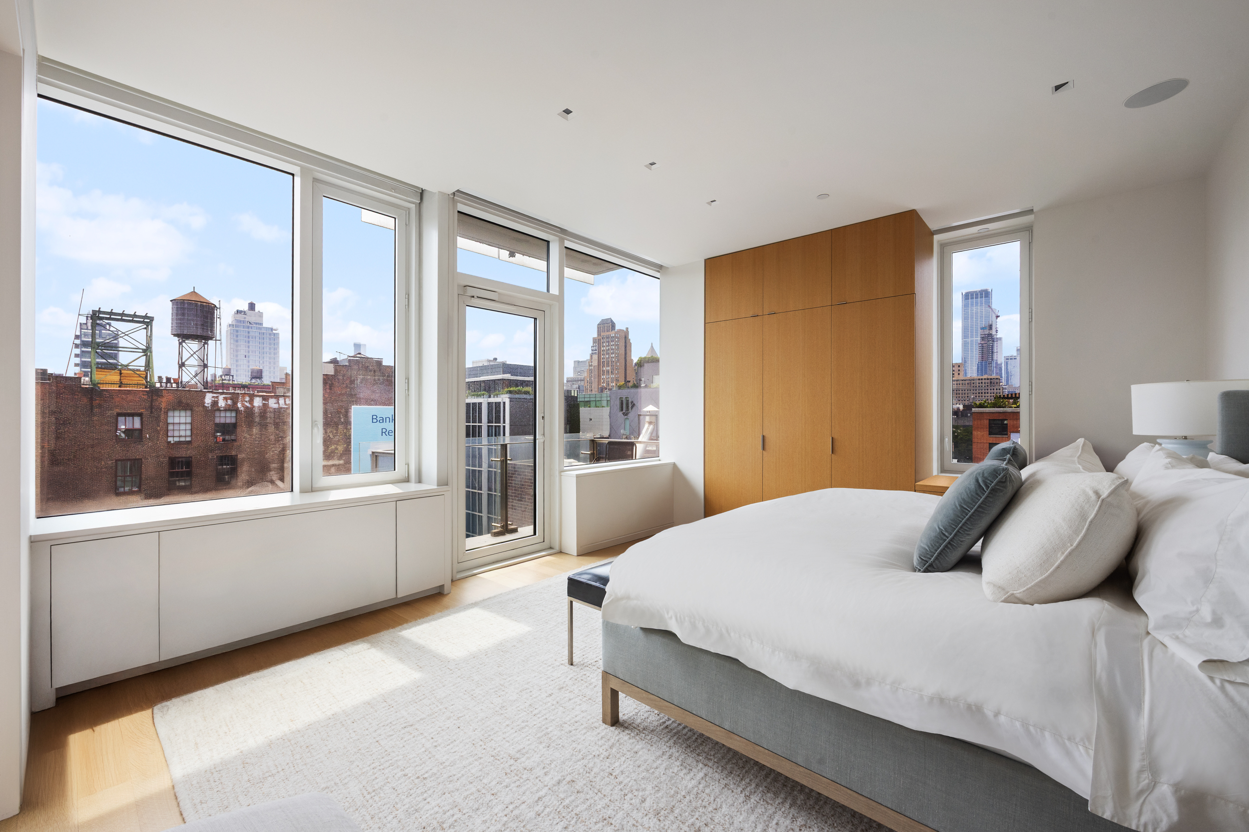 350 West Broadway, Unit 7 Manhattan, NY 10013 - Photo 7 of 17 a bedroom with a large bed and a large window