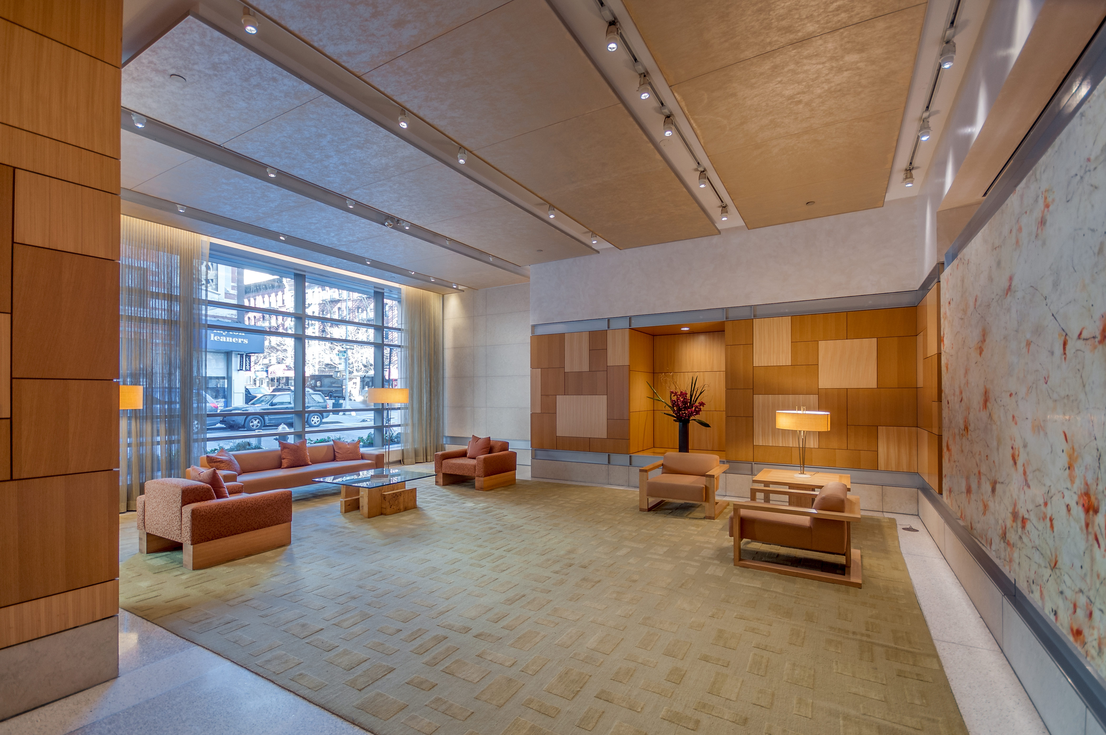 450 East 83rd Street, Unit 3D Manhattan, NY 10028 - Photo 13 of 15 a room with gym equipment and a large window