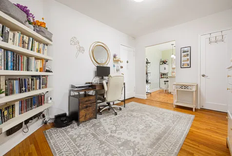 a view of a workspace with furniture and toys