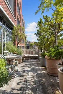 a view of a backyard with sitting area