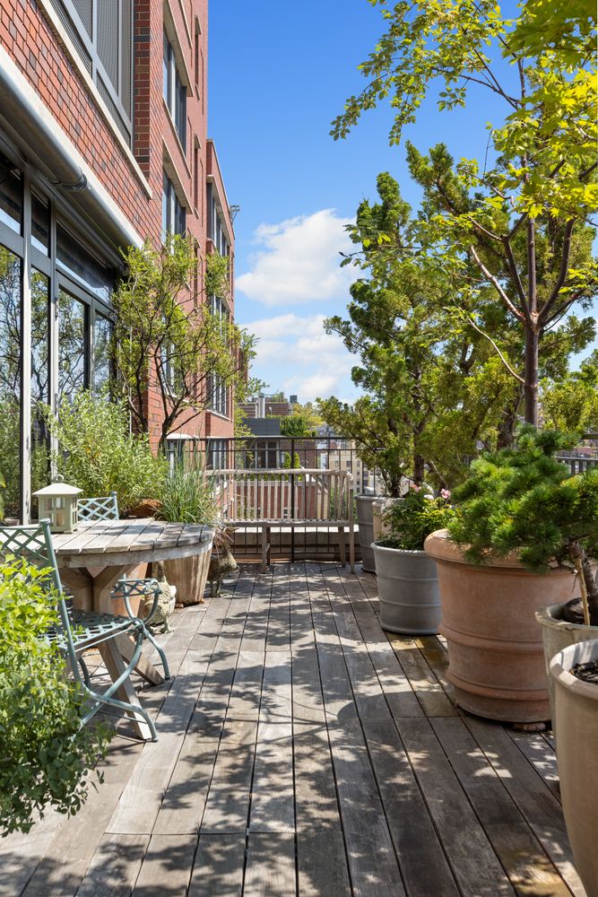 a view of a backyard with sitting area