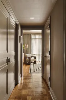 a view of a hallway with a living room