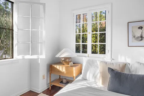 a bed room with furniture and a window