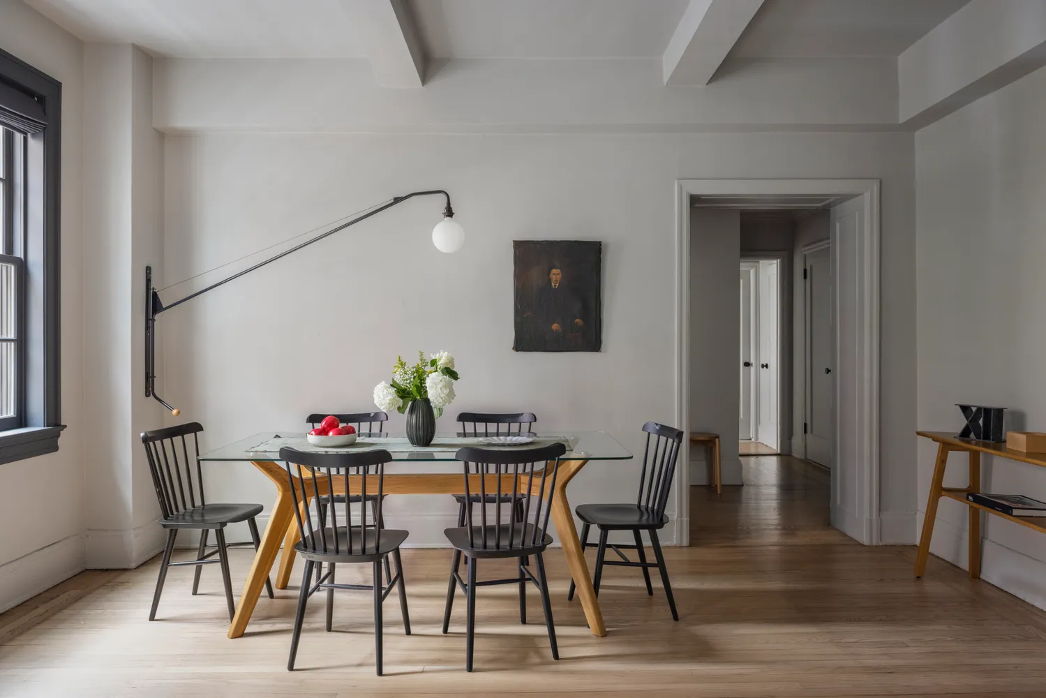 a view of a dining room with furniture and wooden floor
