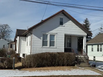 a front view of a house with garage