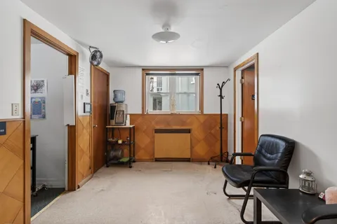 a workspace with furniture and window