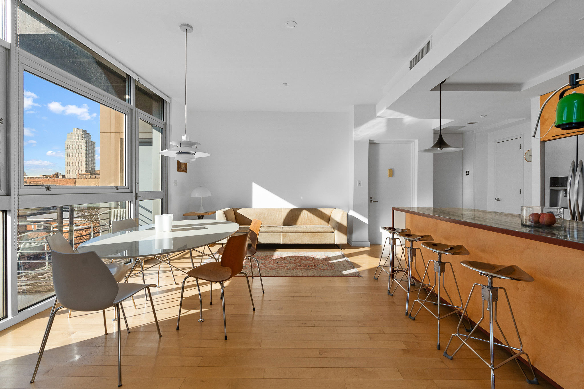82 Guernsey Street, Unit 3B Brooklyn, NY 11222 - Photo 5 of 18 a living room with furniture and a large window