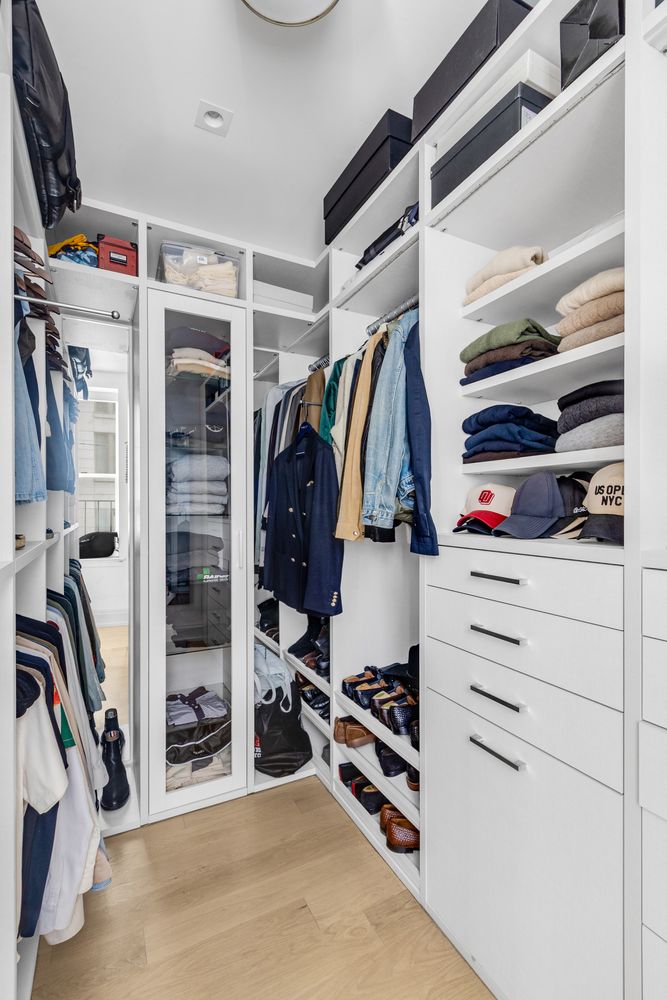 344 West 72nd Street, Unit 1008 Manhattan, NY 10023 - Photo 11 of 35 a view of walk in closet with clothes and shoes
