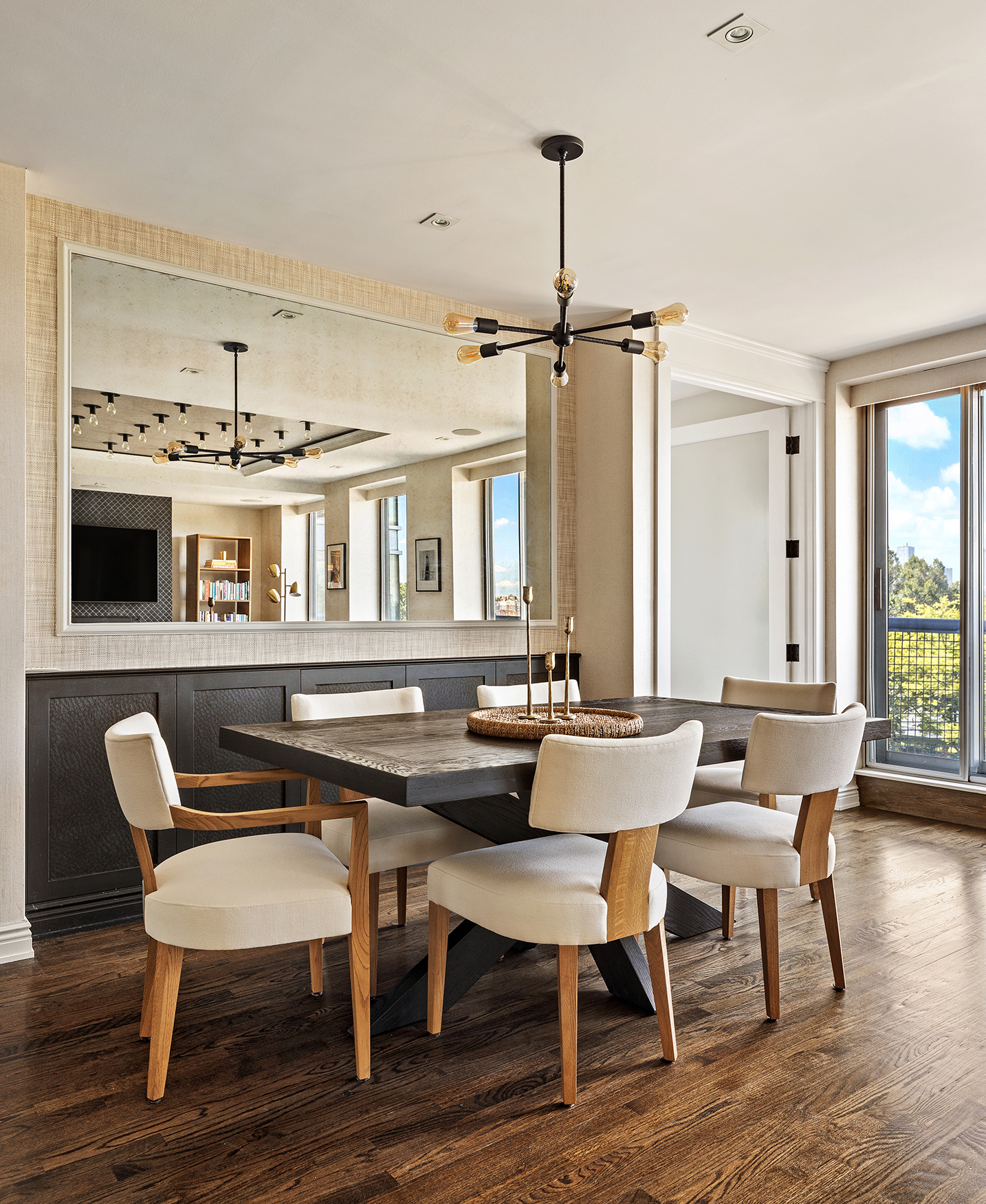 167 Perry Street, Unit 4NQ Manhattan, NY 10014 - Photo 4 of 20 a view of a dining room with furniture window and wooden floor